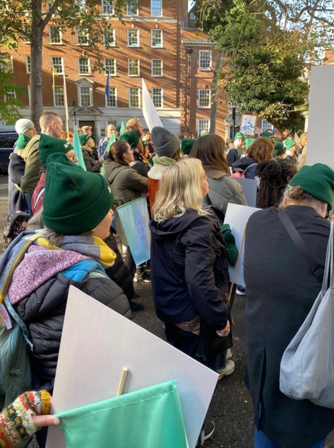 AEPsychologists's tweet photo. 🪧 The green flags (and winter hats) are out in London this morning showing support for the campaign to save EP services - as many EPs take their first day of strike action.
💚

#SaveOurServices #TwitterEPs https://t.co/DhrGJVtCCR