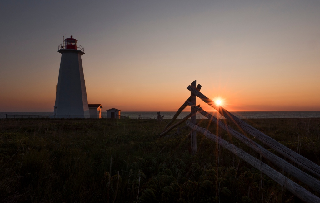 A beautiful sunset at Cape Anguille lighthouse in Newfoundland - the perfect way to end the day! #Newfoundland #CapeAnguilleLighthouse #Sunsets