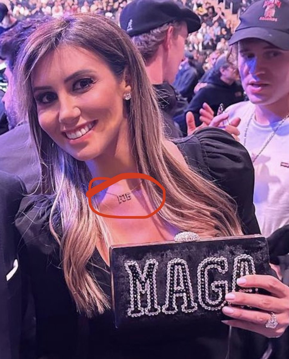 patriottakes's tweet photo. New York Jets owner Woody Johnson and Trump lawyer Alina Habba at the UFC match.

Habba is holding a MAGA clutch and wearing a “FJB” necklace. https://t.co/b4n8SIDbfm