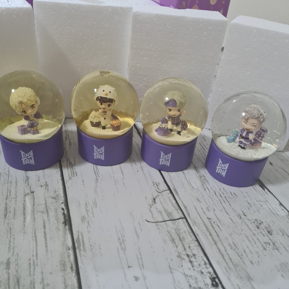 november_twt's tweet photo. I want to display my BTS snow globes but the water turned yellow, only 1 has stayed clear. Is it supposed to be like this? @TinyTANofficial this is way expensive for a snow globe and the product should have a good quality. https://t.co/wgo5Tc4REi