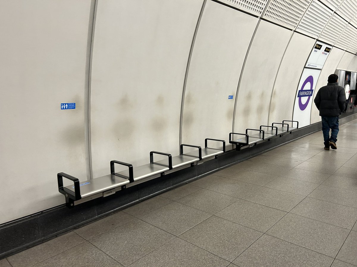 Waiting in line.
Greasy ghosts on the Elizabeth Line.

Rows and rows along the length of the platform. Strangely haunting.
