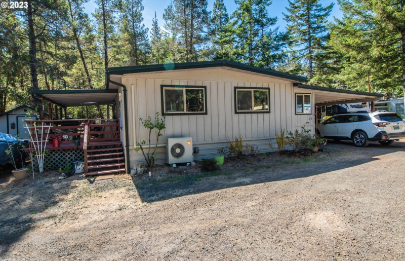 Discover lake living at its finest! 🏡 2 bed, 1 bath manufactured home at 88875 Bayberry Ln #24, Florence, OR 97439. Spacious kitchen, covered deck with stunning lake views, and direct boat access to Mercer Lake. Perfect for a weekend escape or forever home. Make it yours!