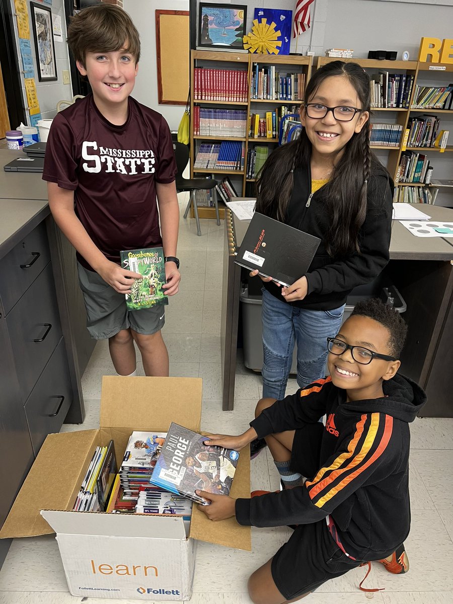 LawhonTPSD's tweet image. These 5th graders are helping Mrs. AB Williams unpack new books for our library. These books were purchased from our proceeds from the book fair we had in September! 🤩 #tpsd
