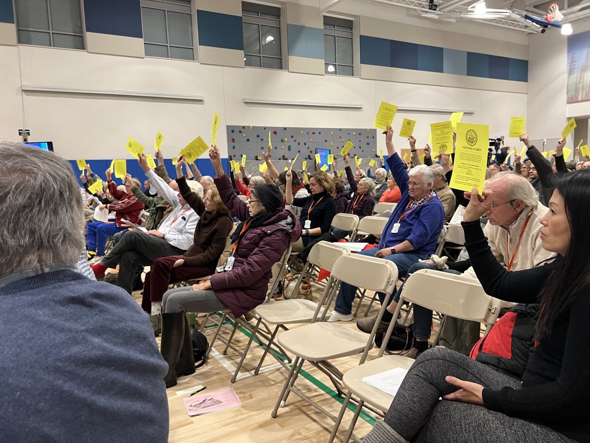 By a show of yellow cards Special Town Meeting authorizes the Manchester-by-the-Sea Select Board to enter into a 10-year lease with Harbor’s Point Associates for the use of the Community Center Building for various community needs.