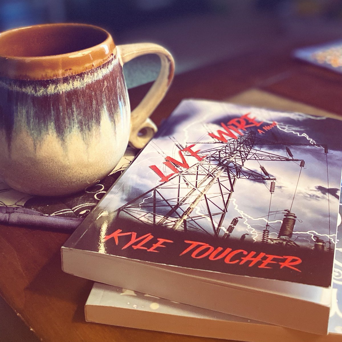 woffordleejones's tweet photo. Enjoying the hell out of my latest by @KyleToucher and @crystallakepub. Lovin’ the characters, dialogue, and description. It’s the perfect storm. #newread #latestread #livewire #coolcover #abookandcoffee #coffeeandabook https://t.co/TItdQEL2hV