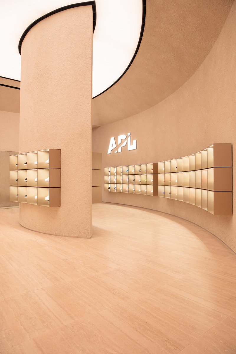 AdamGoldston's tweet photo. 🗣️Another Perfect Location: The World of APL NYC is now open at 75 Prince St. Building this experience has been a tremendous exercise in design, dedication, effort, materiality, and perspective.

We searched nearly 2.5 years to find the perfect home for the World of APL in New York. At APL, we are solely focused on being the best and executing everything at the highest level with the most incredible details and quality. This space is the embodiment of what we stand for as a brand and what our customers can expect from us. 

As the co-founder and co-CEO of APL, balancing creating the grand vision and strategy for execution is my most important role, and that’s exactly what this required. At 75 Prince St., we took over a completely empty, unrefined rectangular space and turned it into an immersive semi-circle that inspires your emotional desire to explore. Our attention to detail and choice of materials truly set the experience apart from anything that has ever been created in retail and establishes the new bar of what’s possible.

Everything we built was unconventional, from the  artisan laid plaster walls and athletically inspired travertine stadium seating, to the handcrafted, brushed metal APL display boxes and fully diffused lighting that bathes you in its glow from nearly 20 feet above. The 80+ feet of window frontage on one of the most iconic streets in New York lets you peak into The World of APL NYC before you cross the threshold in the front and walk up the stone steps to see the hero moment in the back; the vanity rooms.

Color is a defining characteristic of APL and to bring that to life in the physical form, we created 5 hero vanity rooms in the back that are unlike anything you have ever seen. Each one is an incredibly beautiful and rare natural stone that we (led by @ryangoldston) sourced from all over the world. Trying on shoes has not traditionally been a beautiful experience, and we wanted to change that. The rooms are illuminated by a custom lighting sequence and you sit in a cocoon of rare stone that elevated to over 12 feet high. It’s an experience that words and photos can’t replicate. 

We chose 5 vanity rooms for the 5 boroughs of New York. Each borough has its own personality and that’s why each room is a different color, pattern, and texture. The beautiful part is that while there are 5 separate boroughs, they all come together to form New York City and that’s why all of our vanity rooms intersect at a specific point. 

Building is our greatest passion and that applies to everything we touch. We can’t wait to welcome you into The World of APL NYC and have you to experience the physical representation of everything we care about.
