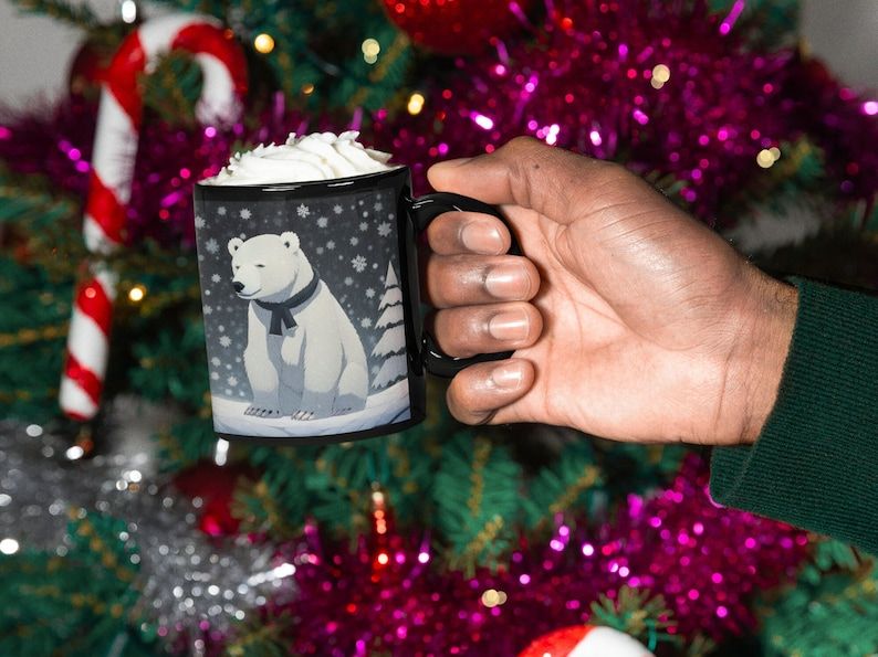 'Polar Bears are getting ready for Christmas! 🎄 Get in the holiday spirit with our 11oz Black Ceramic Mug. Perfect for sipping your favorite hot beverage. Limited stock available, order now! #ChristmasCheer #HolidayMug'buff.ly/47gxOiP
