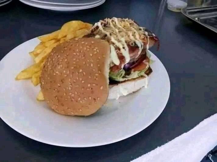 HideoutCafeByo's tweet photo. Hideout's Bacon-wrapped Beefburger.. The best in town! . Call or app 0778142838 for menu and bookings. We are the Hideout Cafe, a Cafe of Choice. #Bulawayo https://t.co/ze80Di5mV2