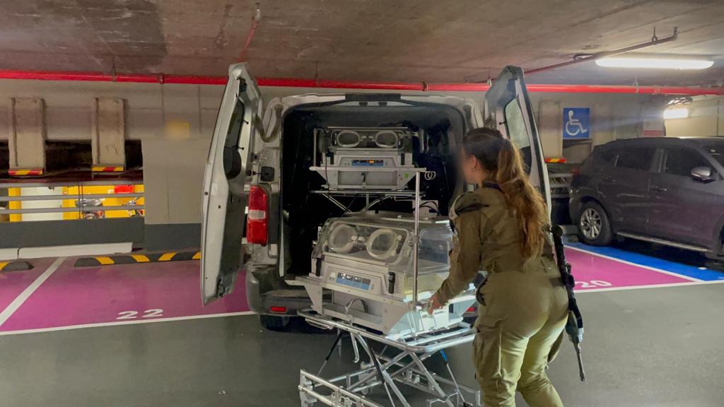 Delivering incubators and oxygen to the pediatric ward for premature babies in Shifa hospital, as coordinated between COGAT and the hospital director.