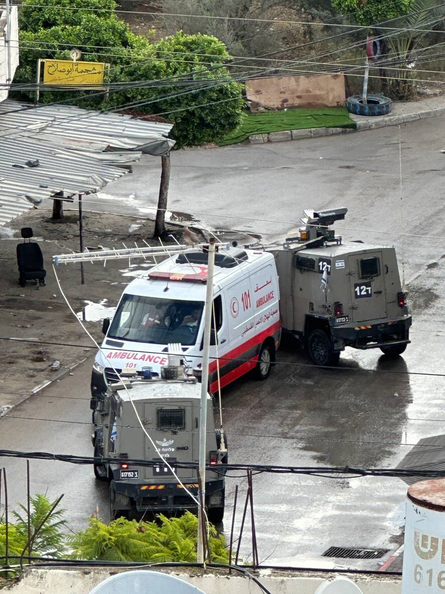 QudsNen's tweet photo. Tulkarm, the occupied West Bank 

Two Israeli military jeeps block the road ahead of an ambulance trying to reach casualties trapped inside the Tulkarm Refugee Camp, where at least seven Palestinians have been killed in an ongoing Israeli military offensive since last night. https://t.co/uYZOcd6Afx