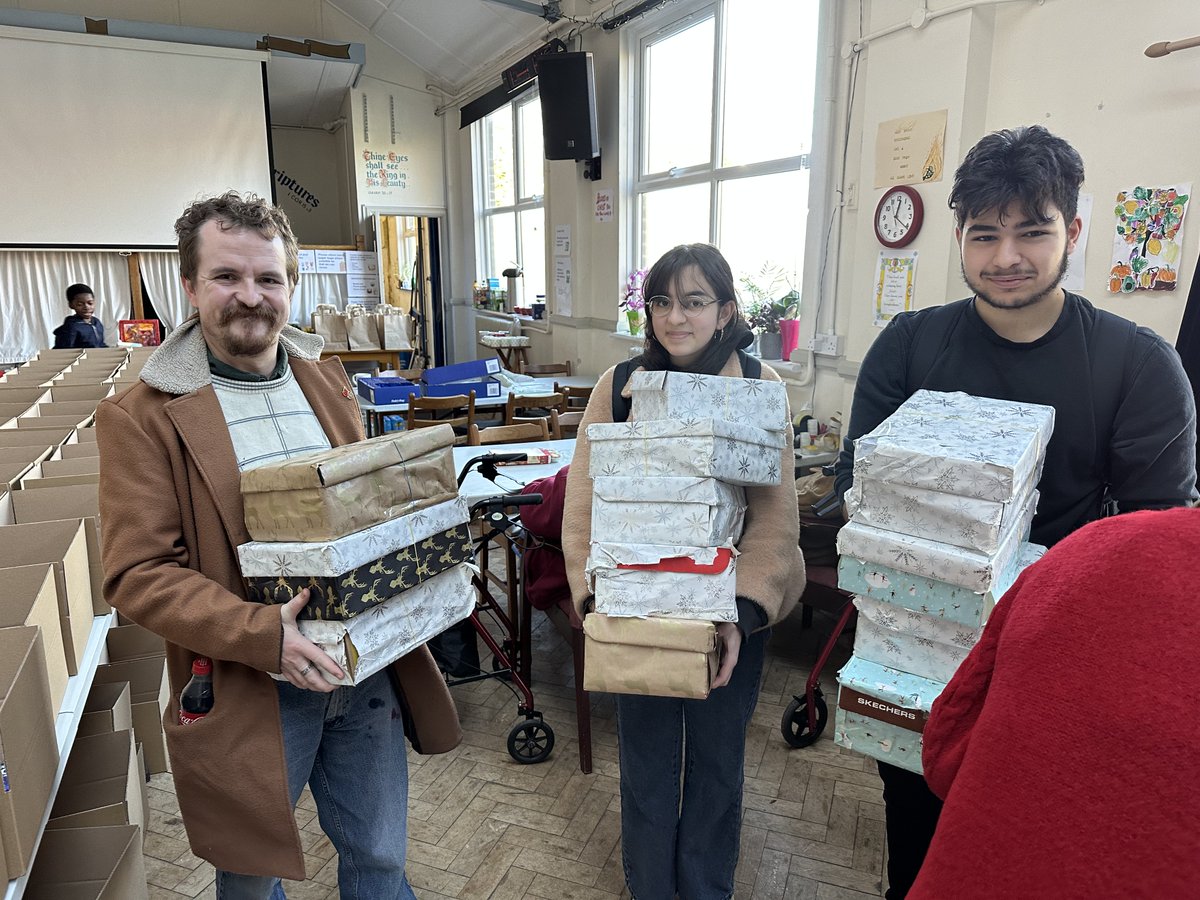 UrswickSchool's tweet image. To coincide with Remembrance, Year 7 and Year 8 have been thinking about being PEACEMAKERS: donating tins to the homeless @Providence_Row, and shoeboxes to @linktohope.  Sixth Former Arzu and Ali volunteered to help with the packing.