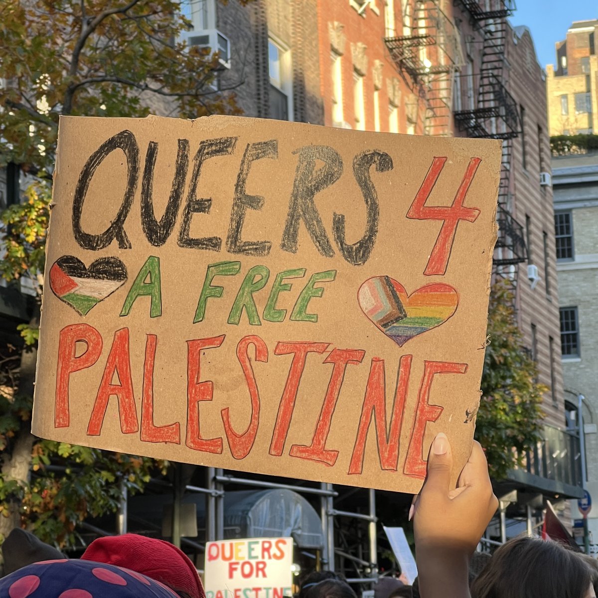 EliErlick's tweet photo. Zionists shouted "fucking f-ggots" and "perverts" at us during Sunday's queers for Palestine march. Yet they want us to believe they support us? It's the perfect metaphor: a few Zionists can yell from luxury condos and have a disproportionate voice over the thousands below them. https://t.co/ukxVETsQba