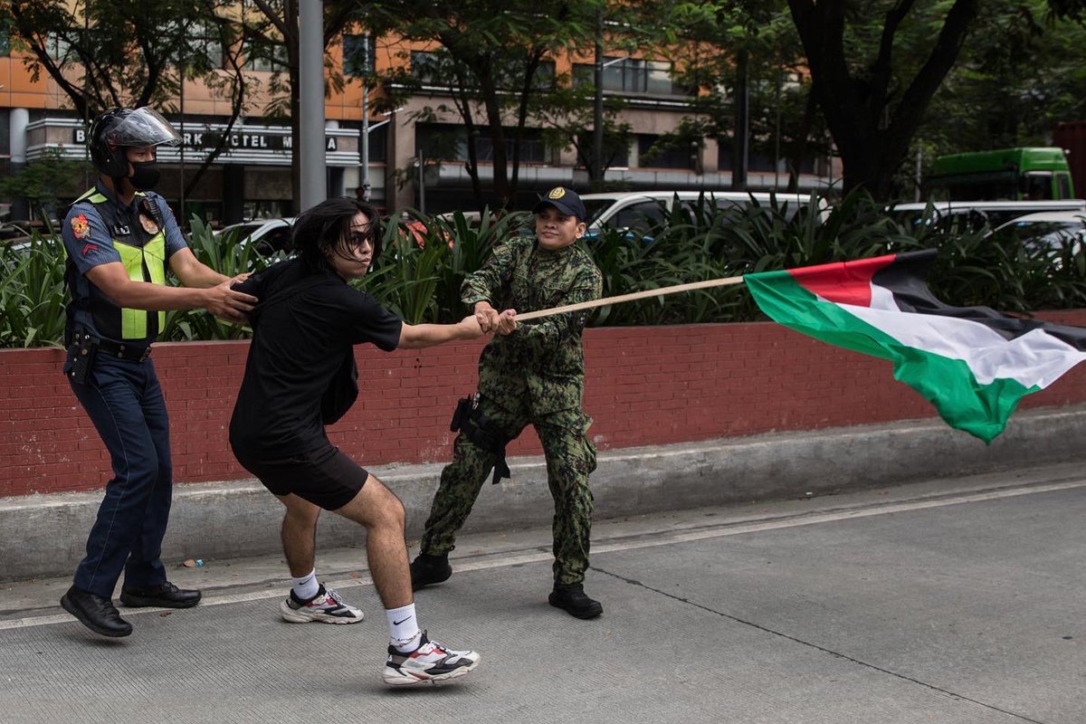 Filipino activists clash with police as they march towards the US Embassy in Manila to protest the US backed genocidal siege waged by Israel in Gaza.