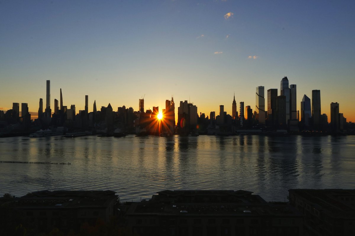 The sun rising behind midtown Manhattan as we approach the upcoming sunrise Manhattanhenge or reverse Manhattanhenge in two weeks in New York City #newyork #newyorkcity #nyc #sunrise