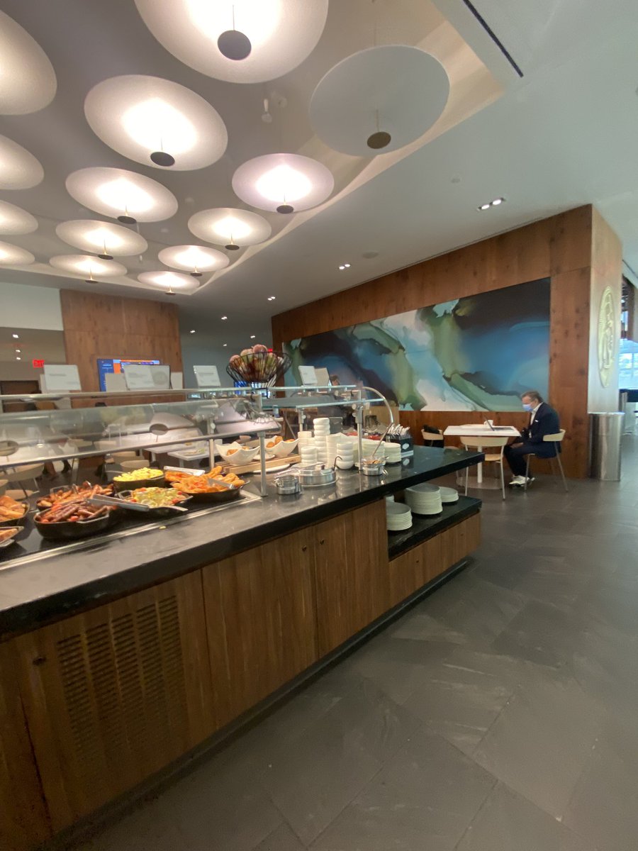 bryceg's tweet image. LGA Centurion Lounge - 5.9/10. Much smaller than I expected, especially for an Amex lounge. Buffet offerings were a bit sparse but food was high quality. Only grab an go options are apples and oranges. No hand lotion in the bathrooms. Random rock band photos everywhere. Just ok.