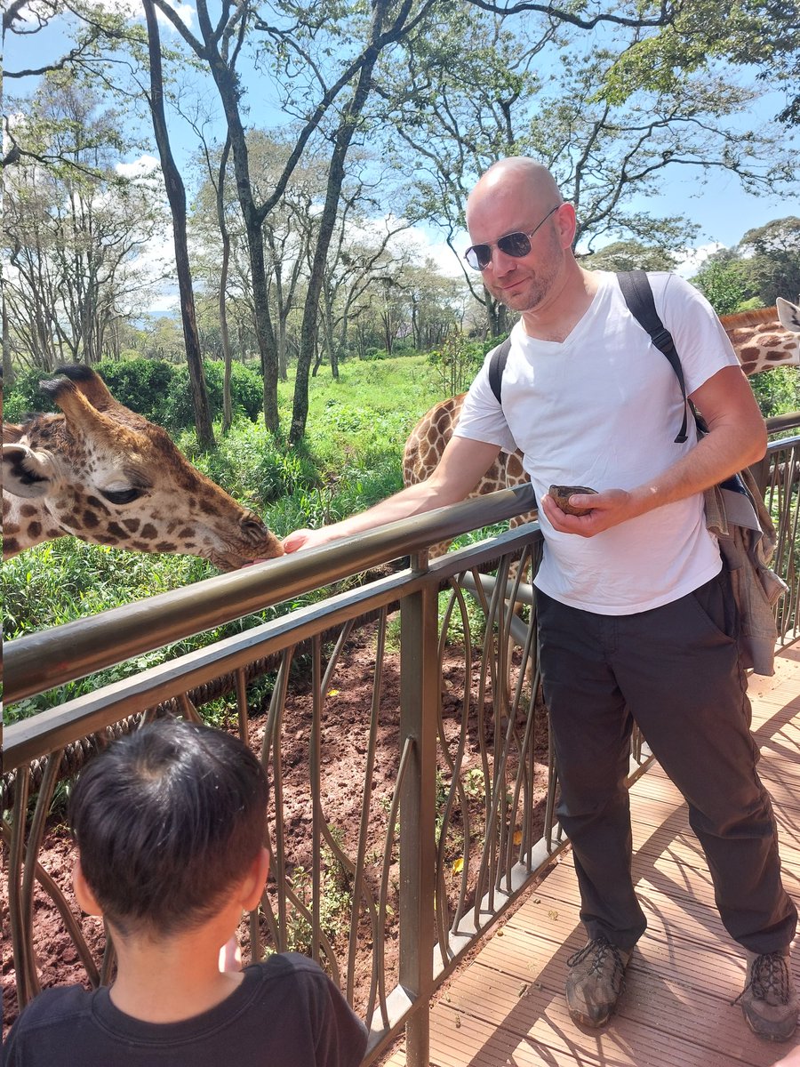 I went to Kenya and I made friends with a python and fed a giraffe