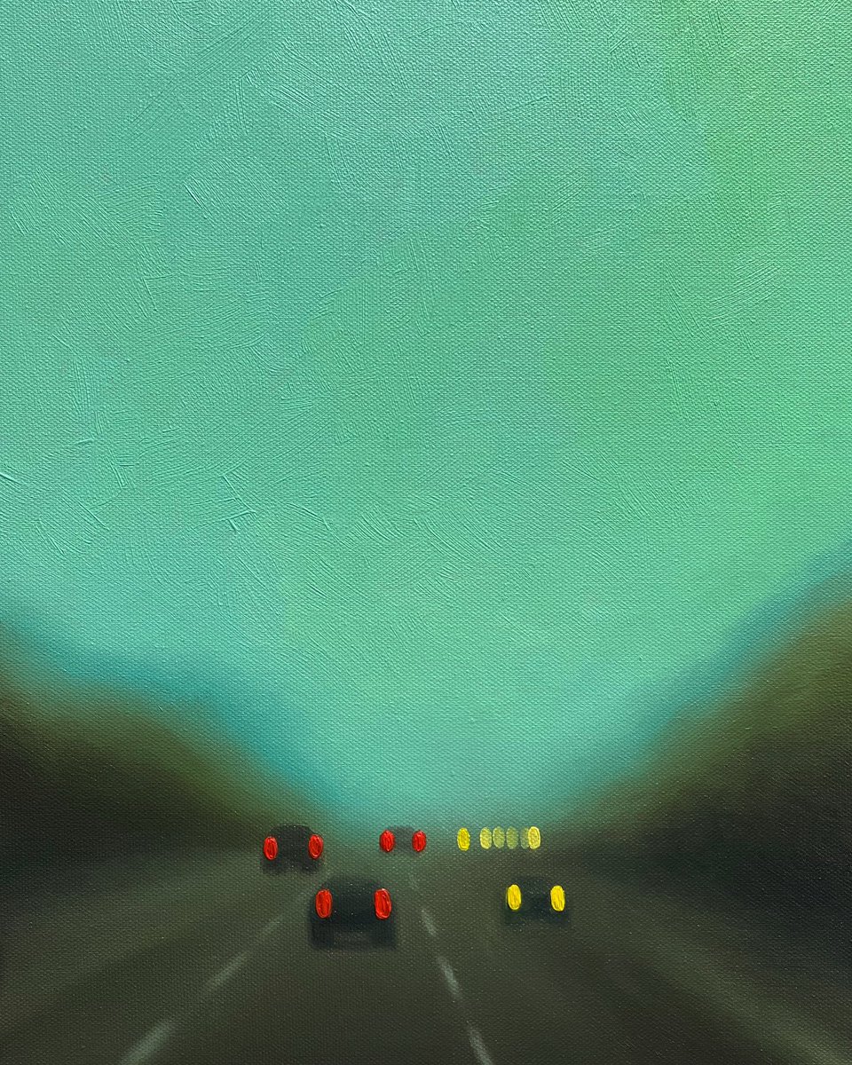 Dim haze of brake lights, silent symphony of solitude, whispering the