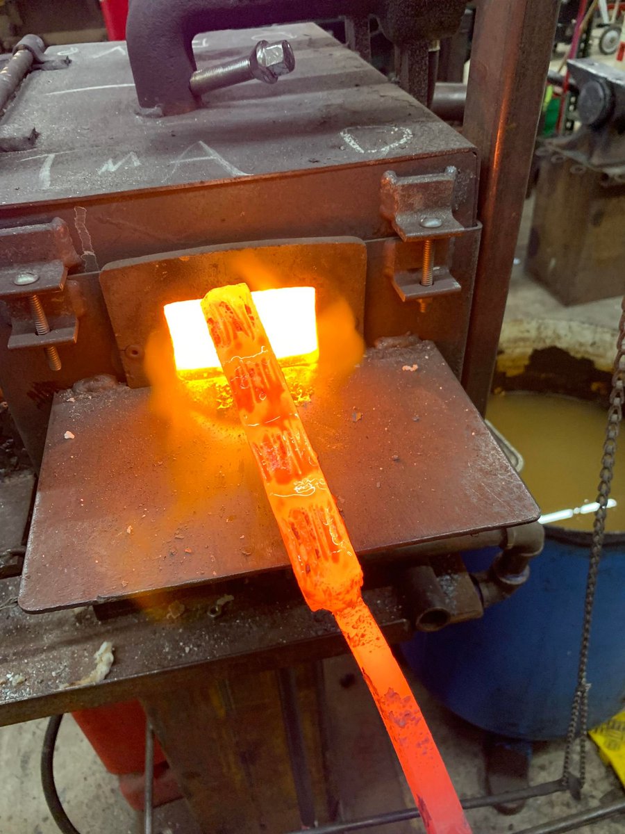 Enginerd_Devin's tweet photo. A friend gave me pieces of her canister Damascus experiments to work with. They were too thin to do much with on their own, so I added more material and am forging a new billet. This is 6 layers of canister Damascus, 3 layers of coil spring, and 10 double layers of bandsaw blade. https://t.co/BDQoBCS5Zo