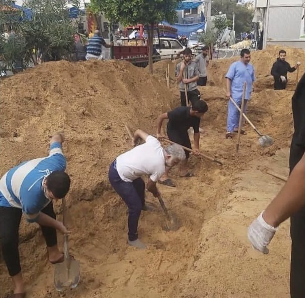 Doctors and civilians were digging a collective graveyard in Al Shifa Hospital today.

At least 100 bodies were buried in the hospital’s yard.