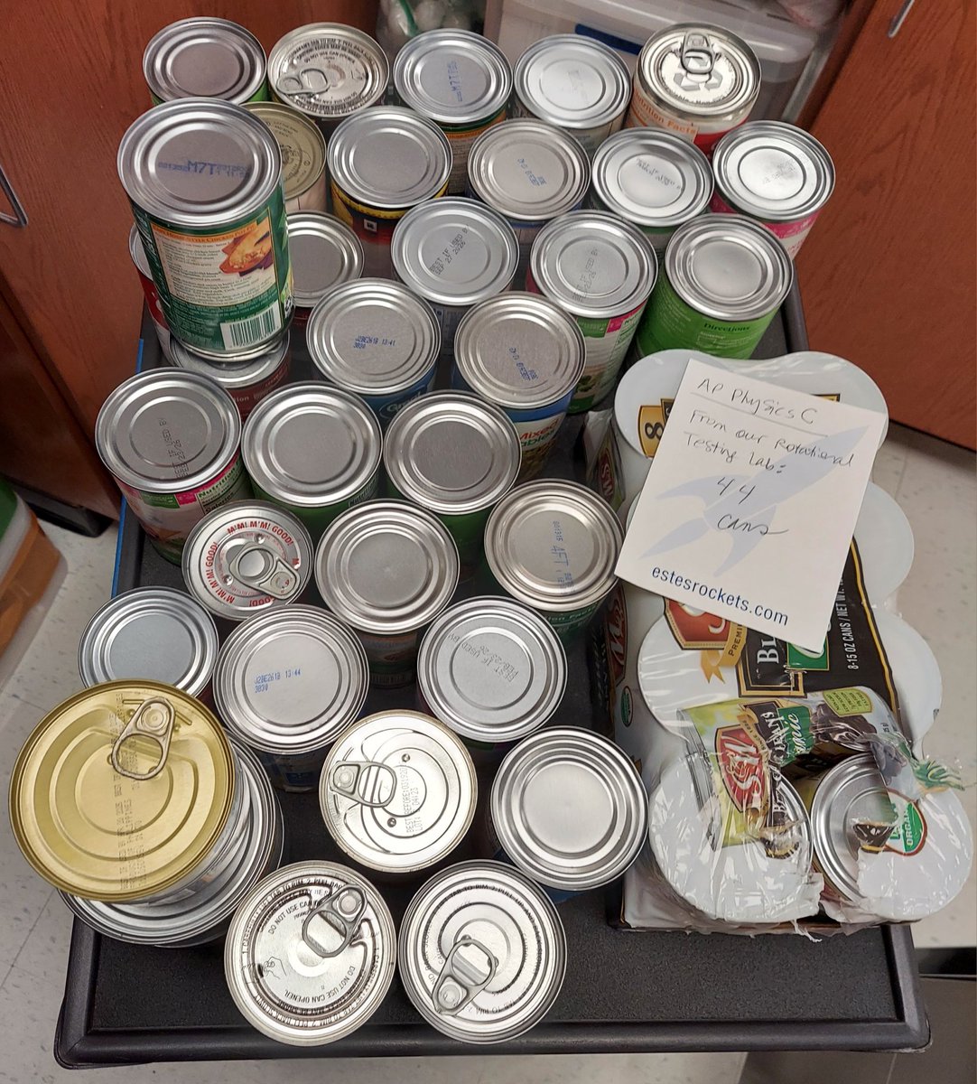 DrHolley's tweet photo. AP Physics C did an applied rotation concepts lab today with various canned goods. Rolls the fastest: beef broth. Rolls the farthest: whole kernel corn. Now we donate all 44 cans to the StuCo food drive! @Amy_Boughton @loridrapp @Hebron_HS @Russell_Said @julia_bergeron https://t.co/SEdO2aRi0d