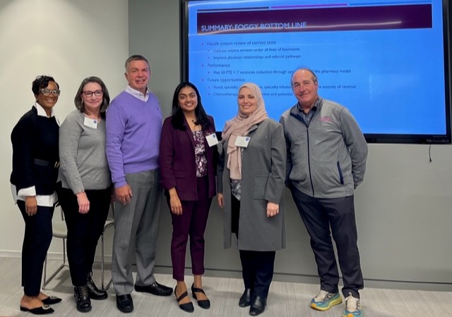 After discussing leadership ethical dilemmas, CPEL candidates engage in small groups to develop strategies for managing complex financial challenges during the capstone at ASHP.