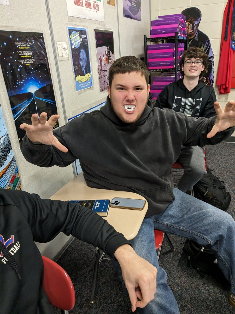 StevenJuster's tweet photo. Handed out DRACULA in SF class!  A pair of fangs go out with every book!  Wonderful young people enjoying their classmates. Most everyone tried them on. @Londonderry_lhs. https://t.co/iJAMnRyrHH