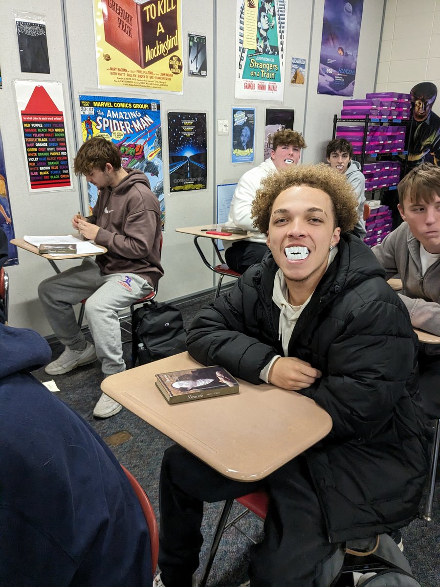 StevenJuster's tweet photo. Handed out DRACULA in SF class!  A pair of fangs go out with every book!  Wonderful young people enjoying their classmates. Most everyone tried them on. @Londonderry_lhs. https://t.co/iJAMnRyrHH