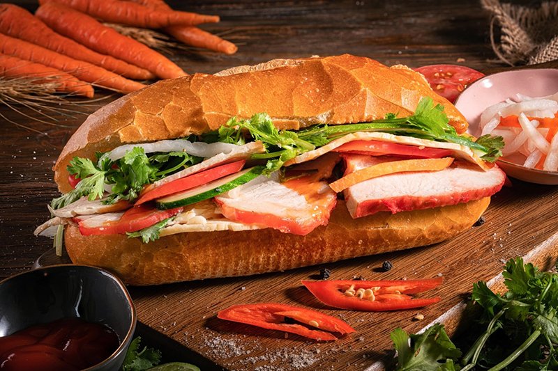 Discover the global sensation of Vietnamese banh mi—a harmonious blend of French-inspired baguette, succulent fillings, and fresh herbs. This cultural emblem adapts to regional tastes, offering variations from north to south. #BanhMiDelight #VietnameseCuisine #CulinaryHeritage 🥖