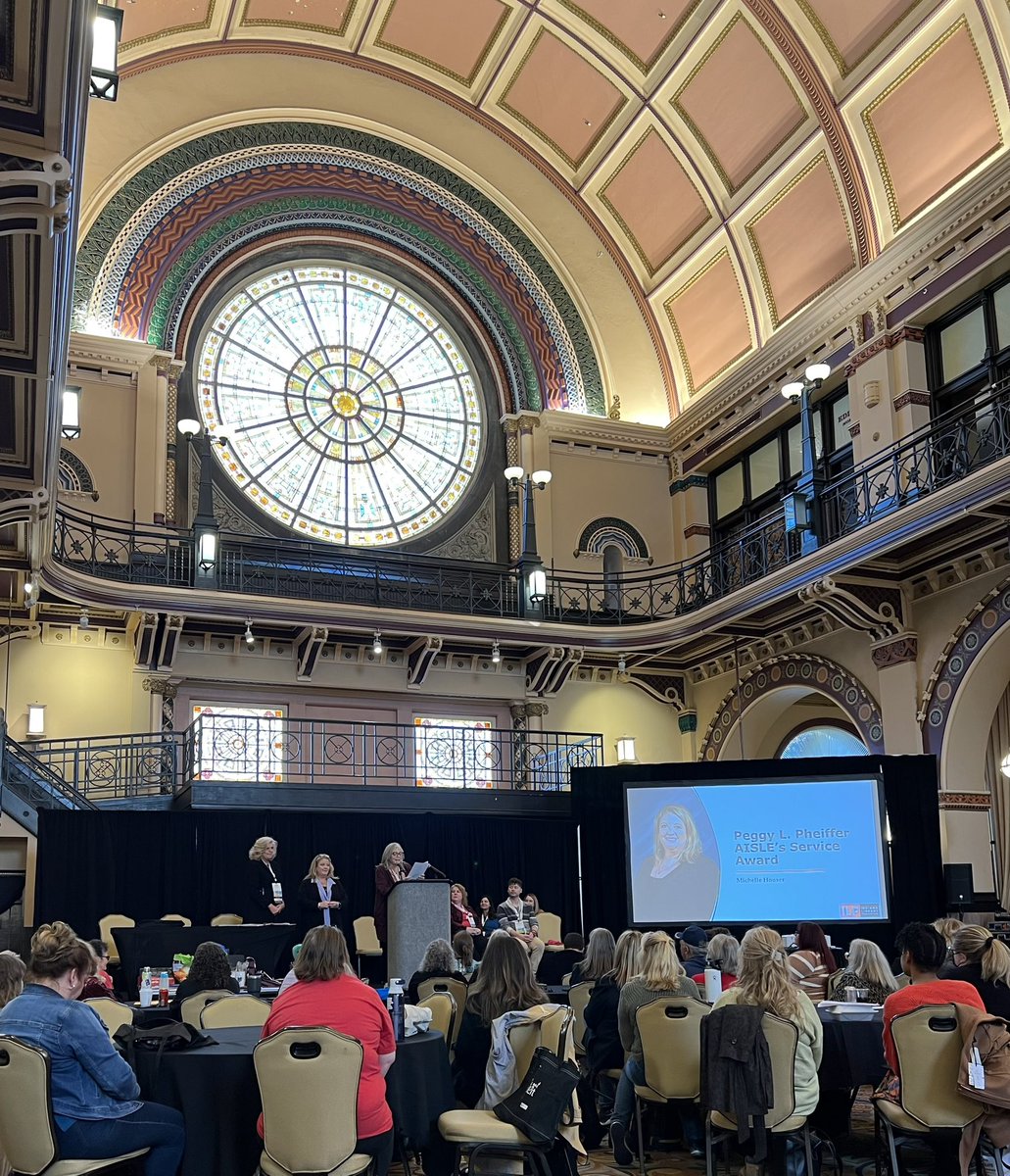 mediamumblings's tweet photo. It was another great day at #ILFAC23!  Lots of great learning and conversation, another presentation completed, and ended the day watching my person @mrshouser68 get an award for her service and dedication to Indiana school libraries and librarians! Congrats, friend! https://t.co/Q81Dok6EnG