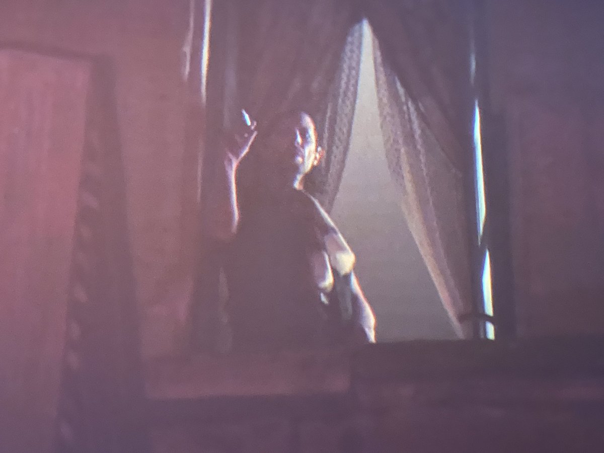 LauriLinnea's tweet image. Trying to figure out why this guy appears briefly in  #Nun2 just before the newsstand flipping scene. Can’t tell what he’s showing out the window and how he is dressed. #MutantFam