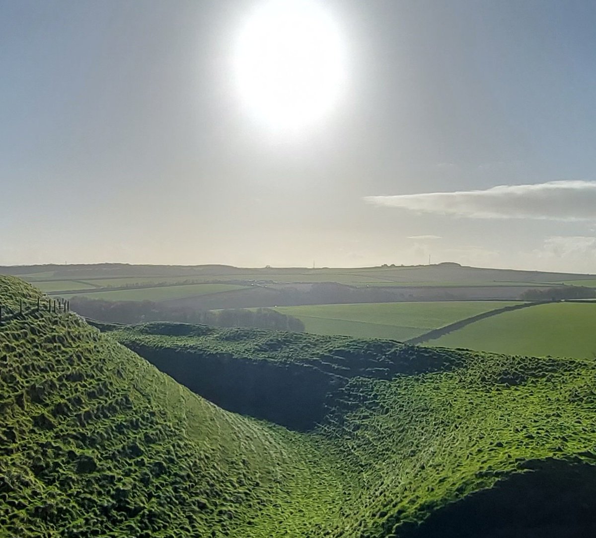 In Dorset this morning, exploring the formidable Neolithic earthworks of Maiden Castle for #HillfortWednesday