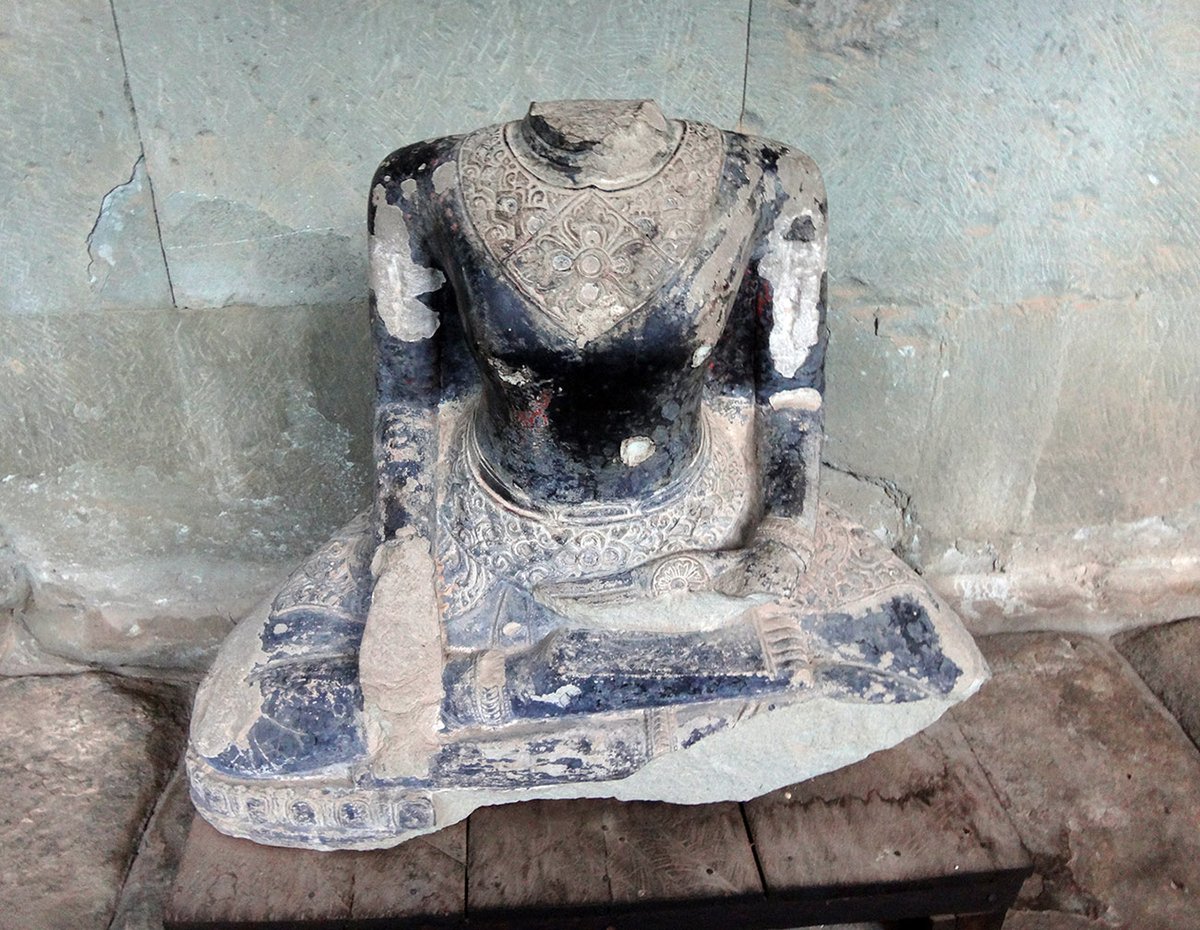 AndyBrouwer's tweet photo. UNESCO International Day against Illicit Trafficking in Cultural Property (14 Nov) - nowhere is safe as you can see from this headless Buddhist adorant found in the corridors of Angkor Wat #Cambodia, the world's largest religious monument. #combatlooting https://t.co/gtVS0G9LdR