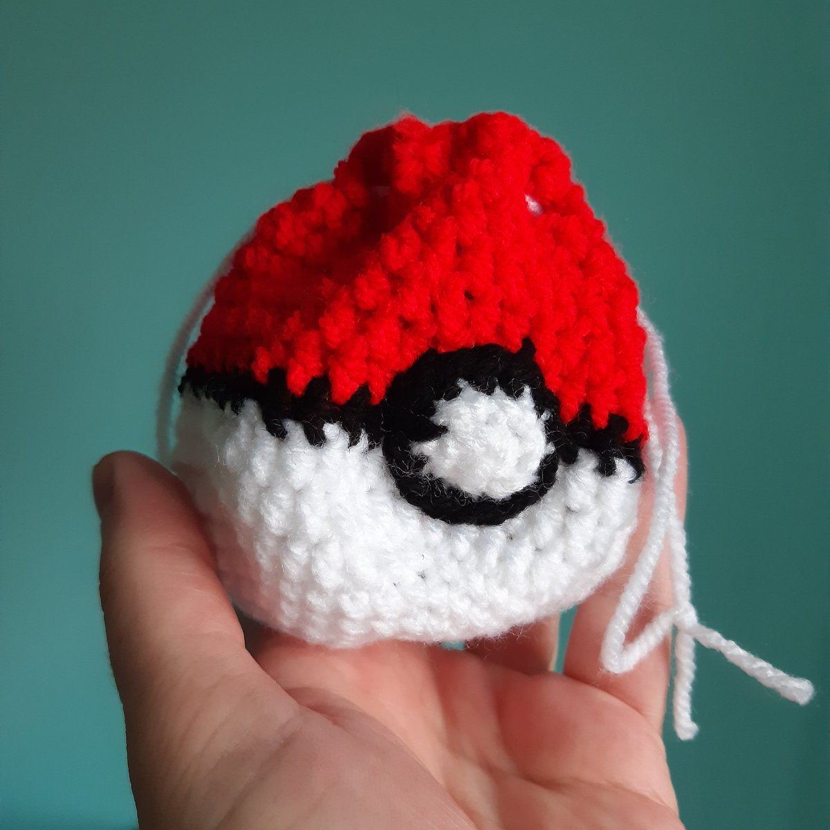 Handmade crochet pokeball drawstring pouch, perfect for storing your dice or other trinkets! depop.com/products/laven…