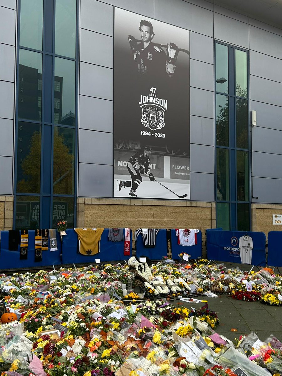 Adam's picture now sits above the memorial in Bolero Square where supporters and loved ones have been laying flowers and paying their respects. @PanthersIHC