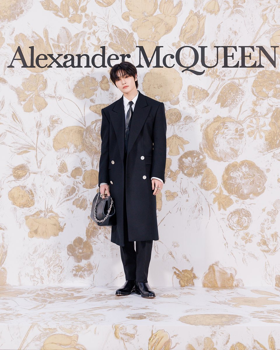 #I_N photographed wearing a black tailored coat and trousers, paired with a white cotton poplin shirt, tie and the #McQueenPeak bag to the reopening of the Galleria East Boutique in Seoul.​

#SeenInMcQueen