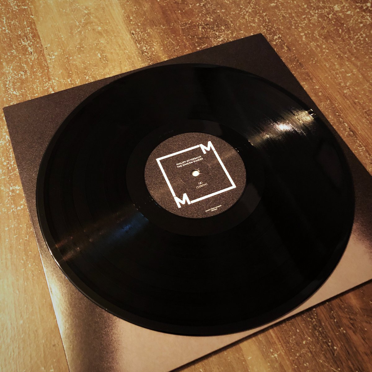 Papenroth's tweet photo. Philipp Otterbach sent me the #vinyl version of his new album The Dahlem Diaries (including some bass tracks from me). It feels great to be able to really touch a piece of music again. I guess I can’t resist buying a #turntable for much longer. #vinylrecord https://t.co/2DrMc0Q1Lh