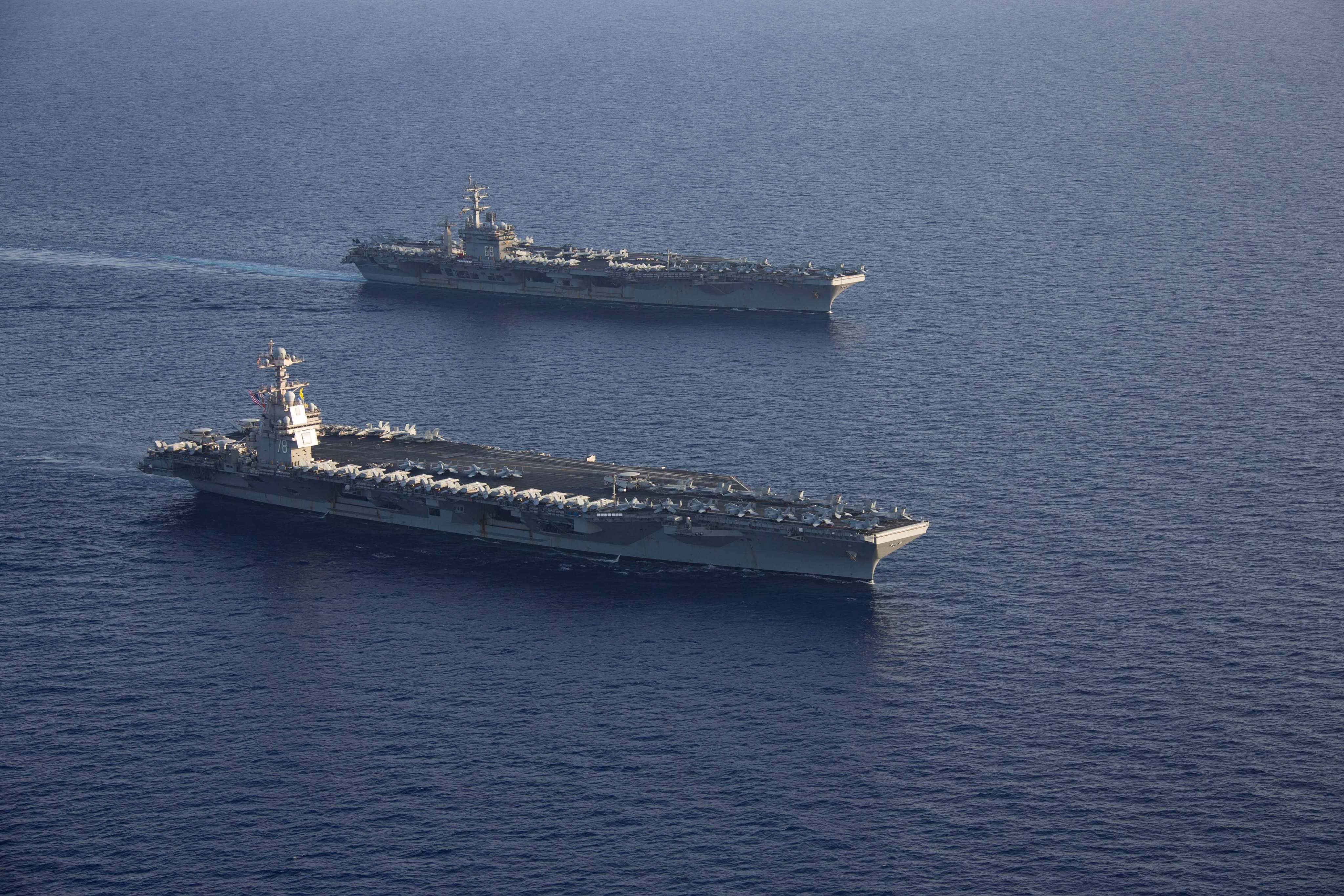 Ships from the Gerald R. Ford and Dwight D. Eisenhower Carrier Strike Groups (CSG), U.S. Sixth Fleet command ship USS Mount Whitney (LCC 20), and Italian Navy frigates Carlo Margottini (F 592) and Virginio Fasan (F 591) sail in formation in the Mediterranean Sea, Nov. 3, 2023. The two carrier strike groups are operating in the area at the direction of the Secretary of Defense to bolster deterrence in the region. (U.S. Navy photo by Mass Communication Specialist 2nd Class Jacob Mattingly)