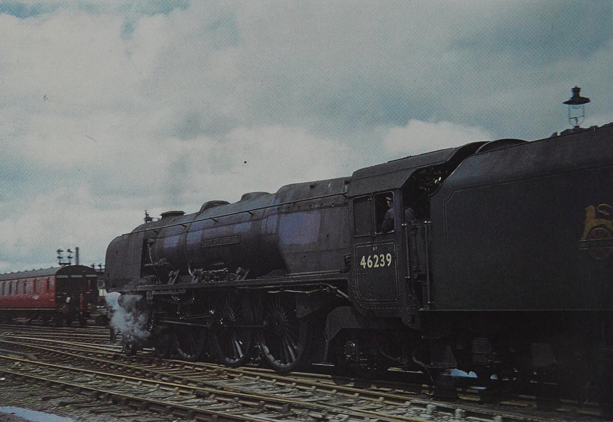 A far cry from C. C. B. Herbert's Crewe shot a year prior, Coronation 46239 City of Chester leaves Rugby in 1951; the grimy state of its livery displaying the reason behind the short-lived nature of Express Blue. It would carry blue until August 1954, when repainted to Brunswick.