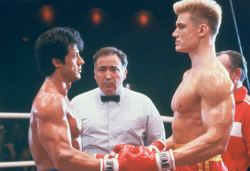 listguy's tweet image. Dolph Lundgren (the biggest guy in the photo) is 66 today. He was born in Sweden, so what's his connection to Washington? Ten years before he hit it big in movies, he studied chemical engineering at WSU! Yes, he was a Coug, 1975-76. He was in the marching band, too.