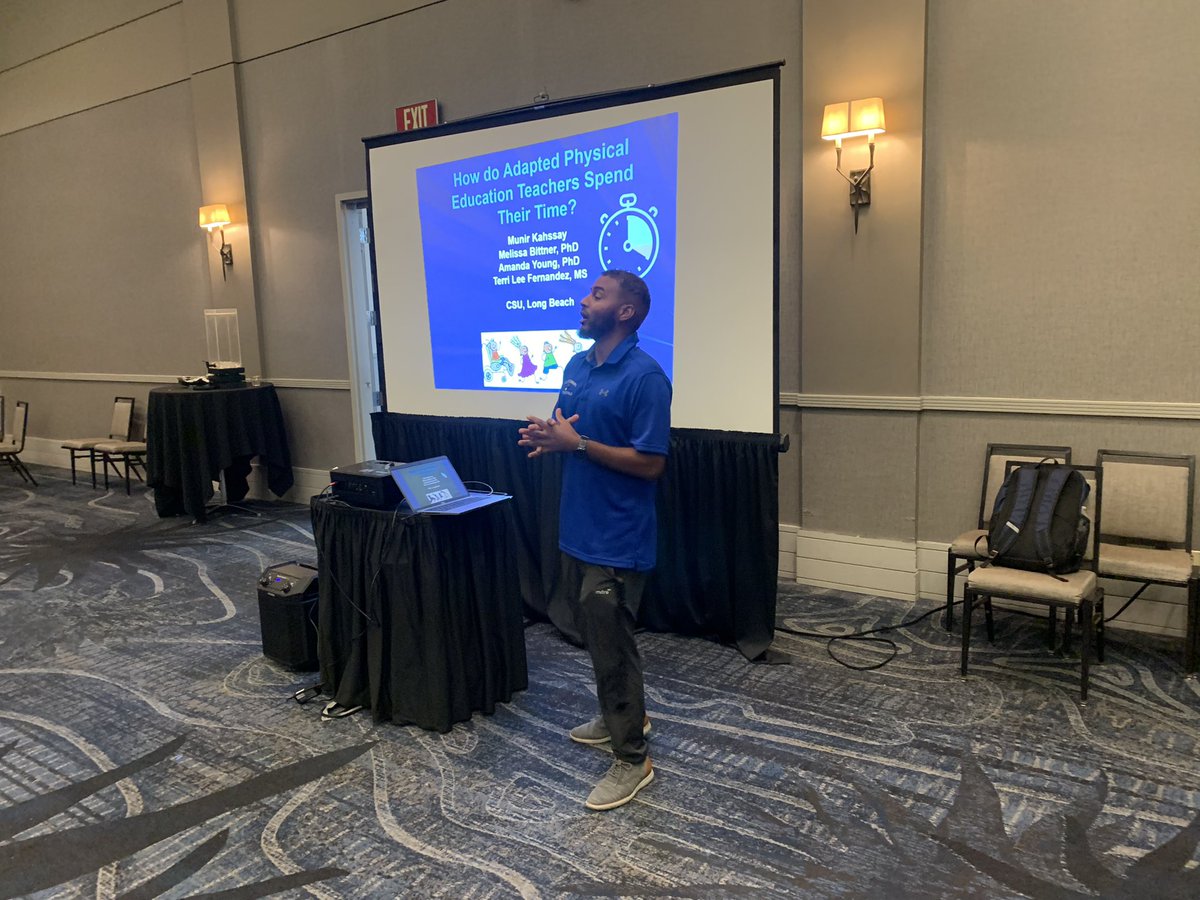 Munir Kahssay presenting on how APE teachers spend their time. #NAPEC52 @longbeachstateape
