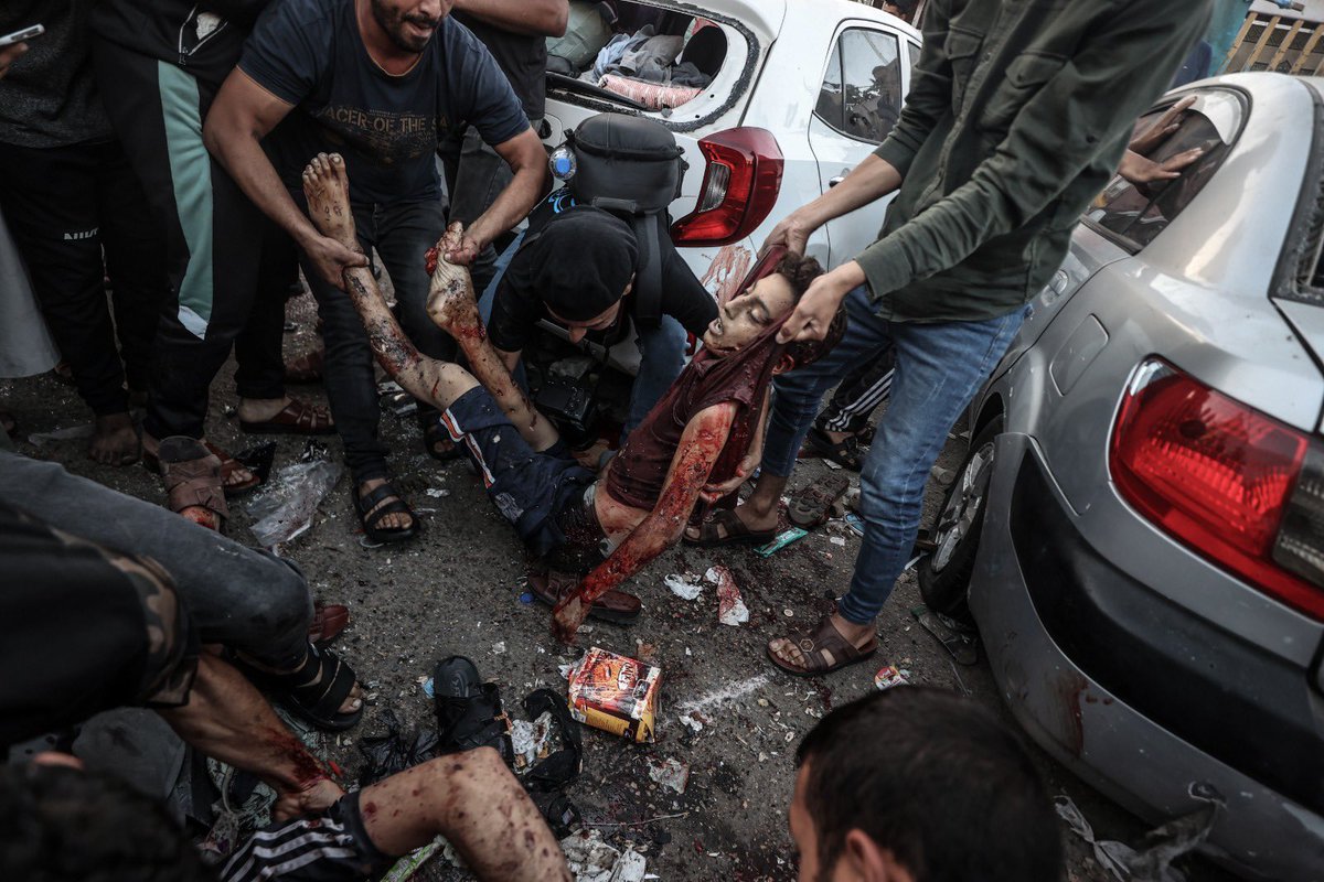 Dead and injured Palestinians are seen on the ground following an Israeli airstrike outside the entrance of the al-Shifa hospital in Gaza City, Friday, Nov. 3, 2023.  (Anadolu Ajansı - 📷Ali Jadallah) #GazaUnderAtack