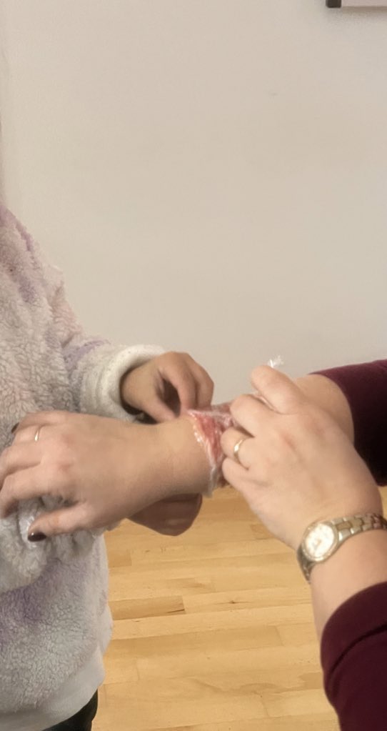 KB_Education_'s tweet photo. We’ve learned all about burns and how to administer first aid ⛑️ so when the staff got “burnt” the children rushed to their rescue, cling film at the ready!! 🔥 🔥 thanks to Sam and his expertise @firstaidschools https://t.co/MH0rebWp7E