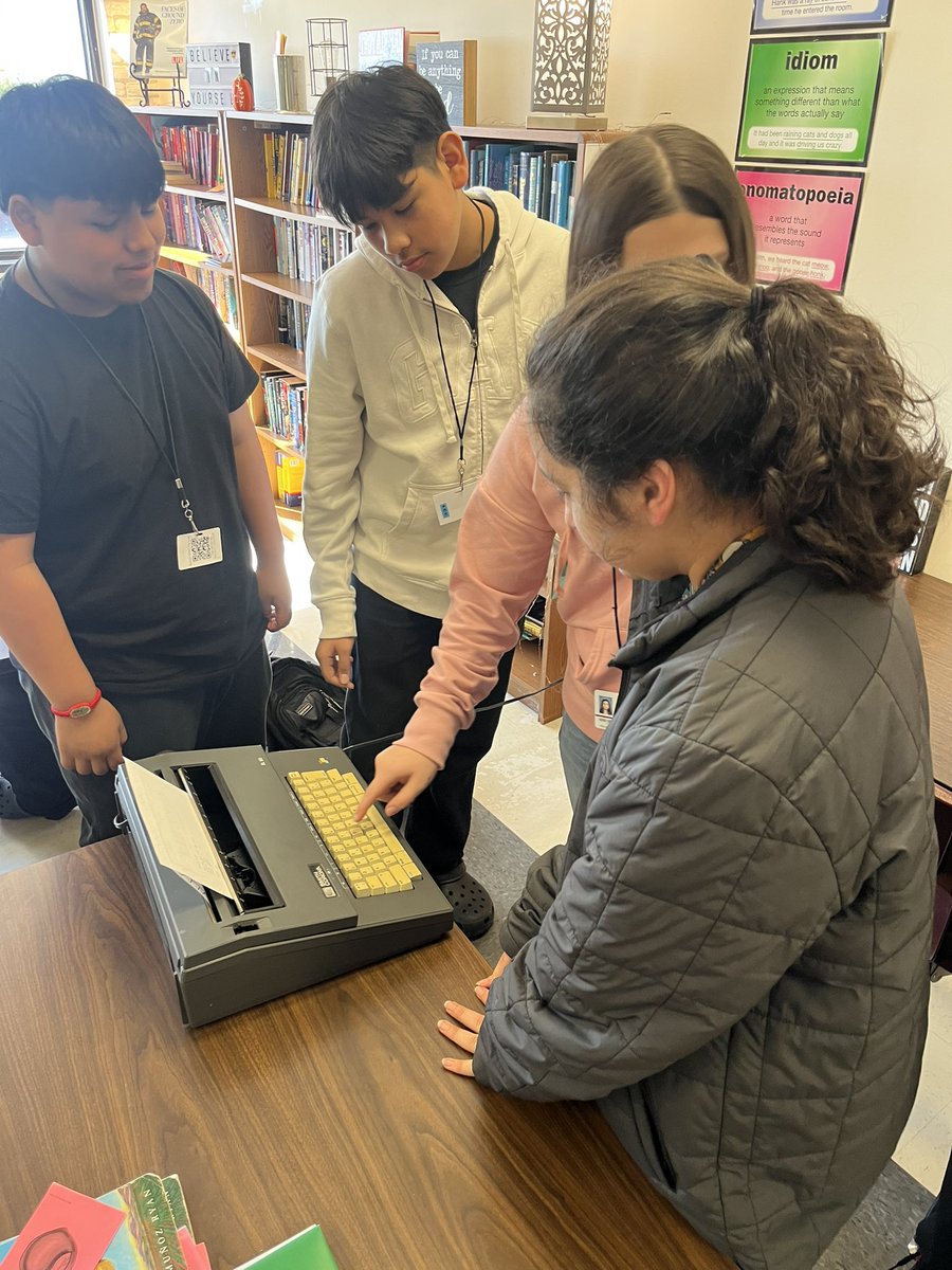 julz66's tweet image. My students are checking out how a typewriter works after finishing the novel “The Outsiders”.  They are impressed that S.E. Hinton wrote the novel without a computer 🖥️  @DeLayMS
