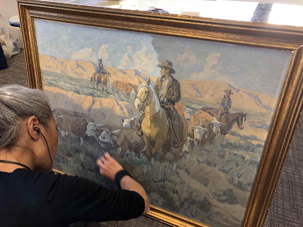 Recently, our collections team was in Cedar City with a conservator to restore paintings in the Iron County School District's collection. Here's the conservator at work cleaning a Paul Salisbury painting, one of 25 she restored in just a few days.  cce.my.salesforce-sites.com/public