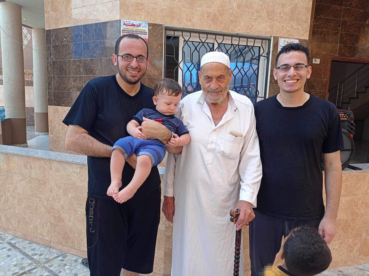 AlnaouqA's tweet photo. This is my family. Two brothers, my father, and the little angel Omar. 

Omar was the only kid who survived the bombing of my house. 

Israel killed Omar’s father, grandfather, brother, sister, 4 uncles, 3 aunties, and 14 of his cousins. 

Israel also destroyed his home and he was injured. 

Everyone in this picture was killed except Omar. But did Omar actually “survive”? 

Omar is still living under bombardment. 

Omar is not safe. 

Omar is a kid.