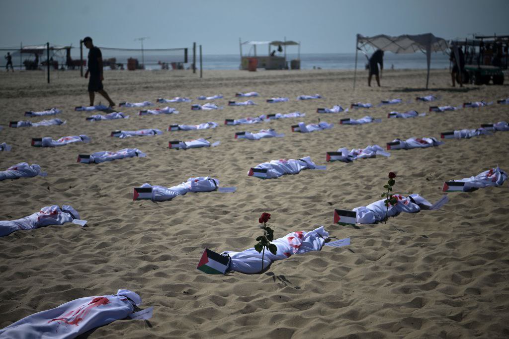 Timesofgaza's tweet photo. With symbolic shrouds, activists in Brazil protest against the lsraeli mass war crimes committed in Gaza Strip. https://t.co/7xJYcceANy