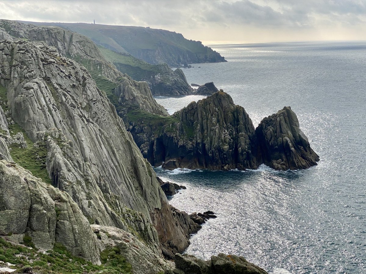 Impressive cliffs that rise four hundred feet above the sea, cut by the power of the ocean into innumerable gullies & caves by the surging storms blowing eastwards from the Atlantic with unbroken force.