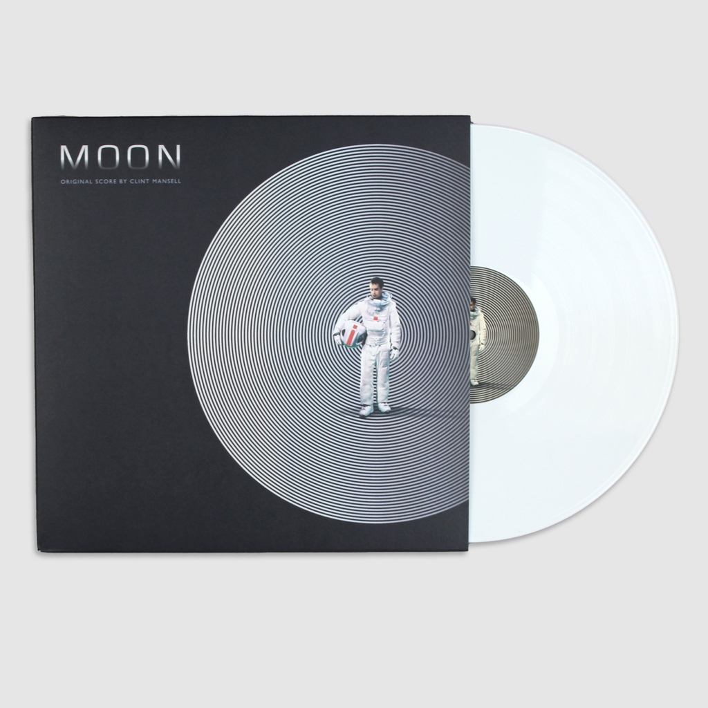 Duncan Jones’ breakout directorial debut Moon returns to Earth with a repress of its evocative soundtrack. Clint Mansell throws electric signals towards interference, transported through eerie atmospheres while emotional passages are woven in between. l8r.it/ExeA