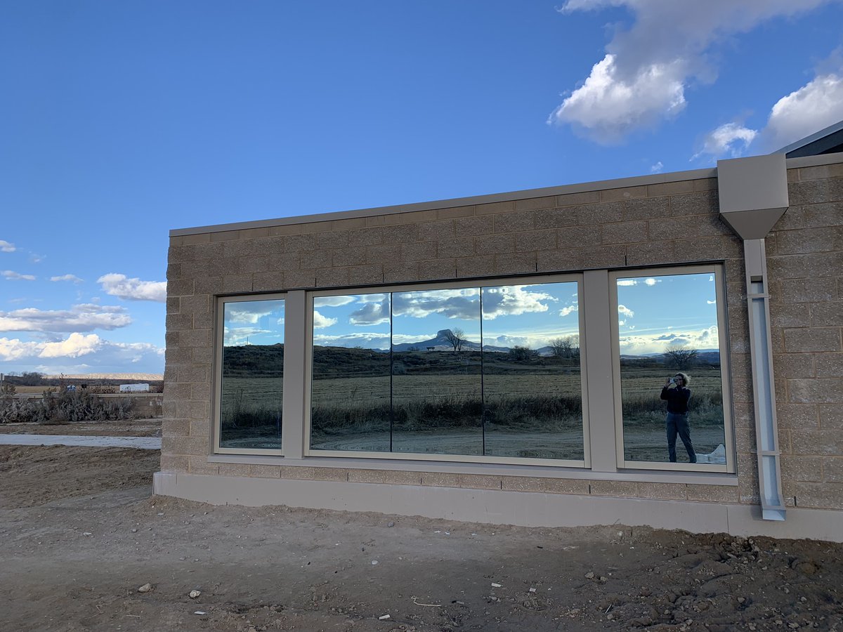 The windows for the new Mineta-Simpson Institute are in, providing a stunning reflection of Heart Mountain.