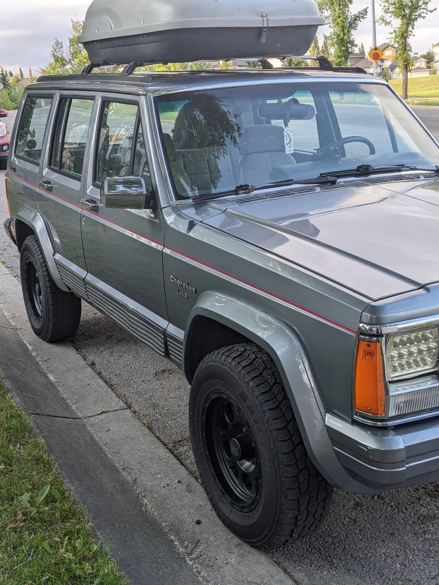 RentonL's tweet photo. Please help us find our silver 1992 Jeep Cherokee Laredo. (4 black rims.) Stolen last night after midnight from in front of our home. If you see it, please notify the police. Don't try to stop it or approach it. Please RT. This Jeep has family sentimental value. @cmcalgary #yyc https://t.co/EPHH56lich